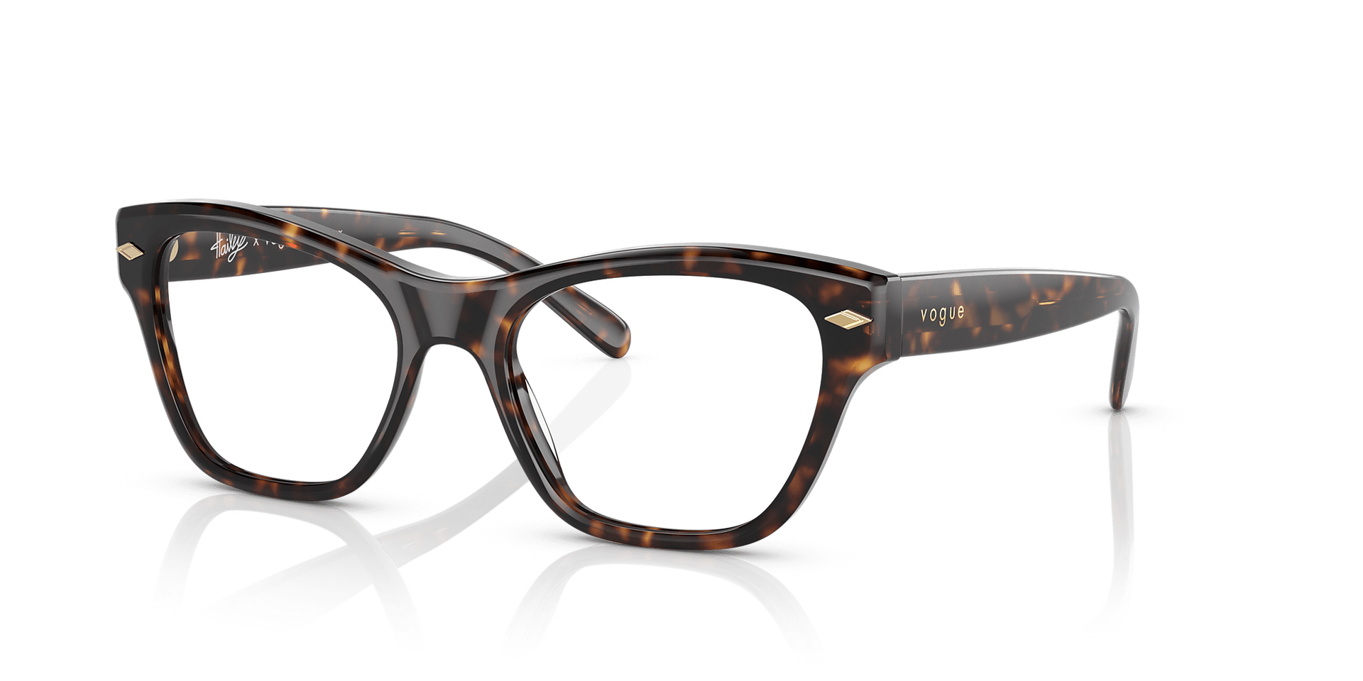 A pair of glasses with a leopard print frame on a white surface.
