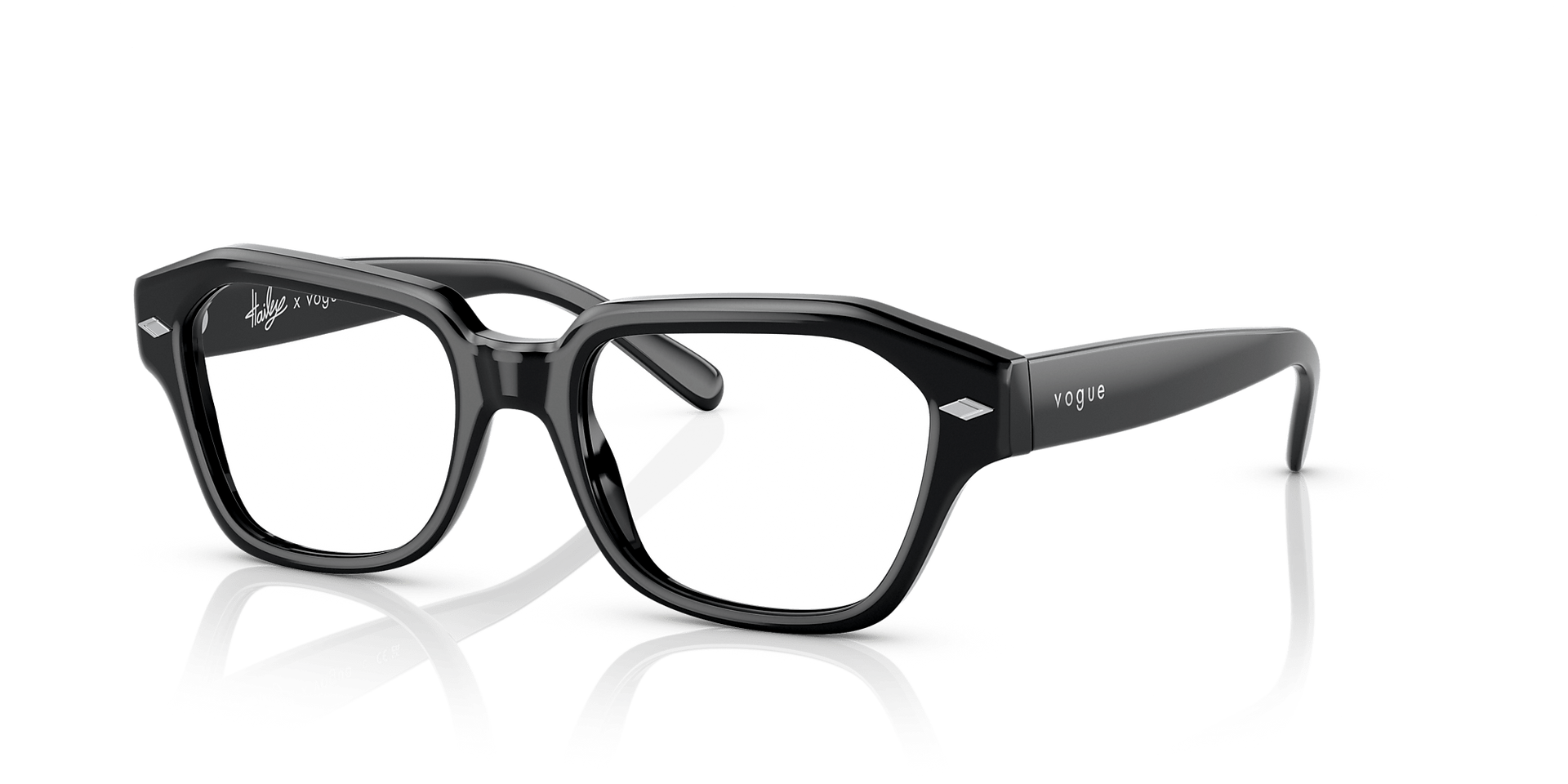 A pair of black glasses on a white surface.