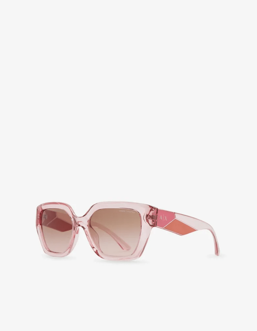 A pair of pink sunglasses on a white background.