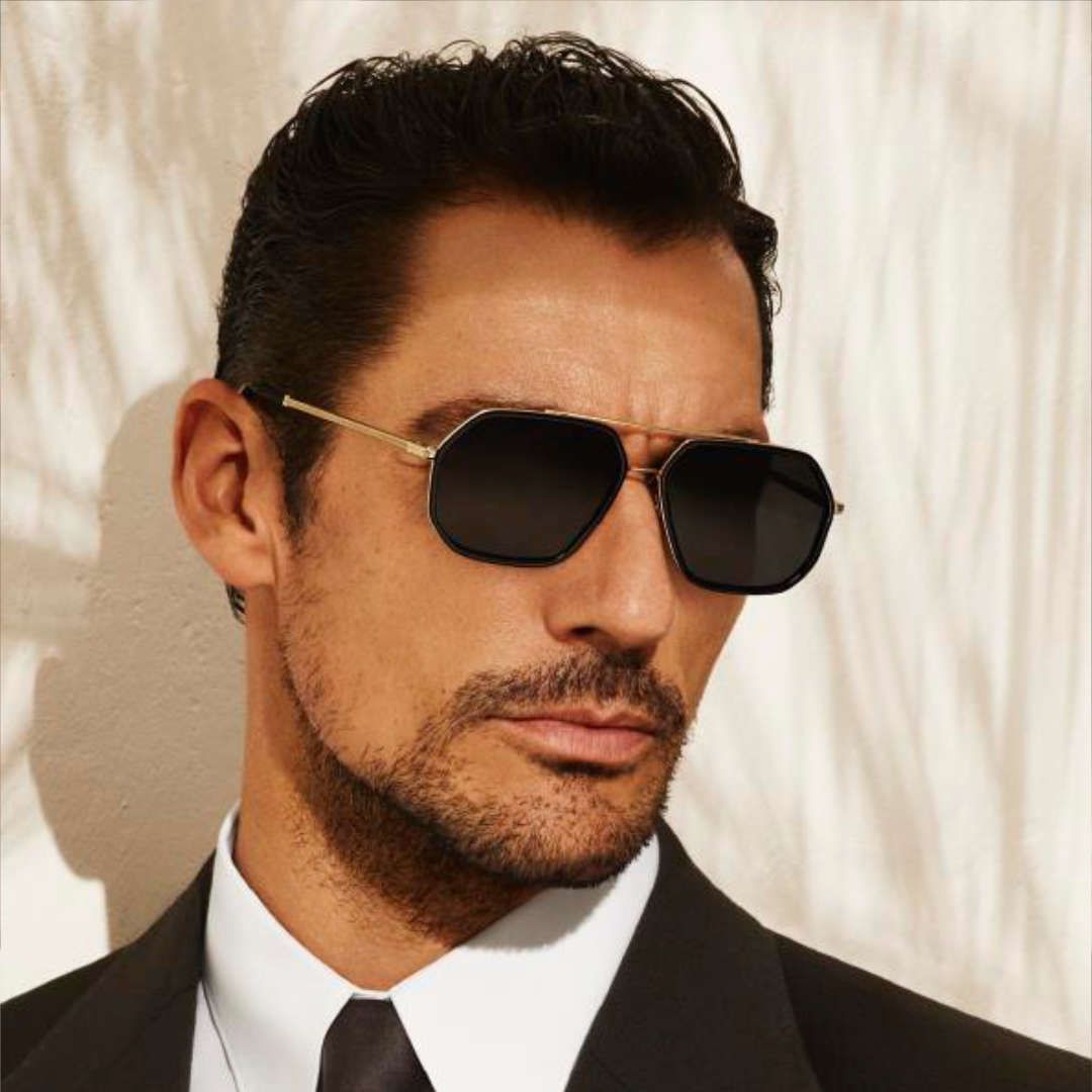 A man in a suit and tie wearing sunglasses
