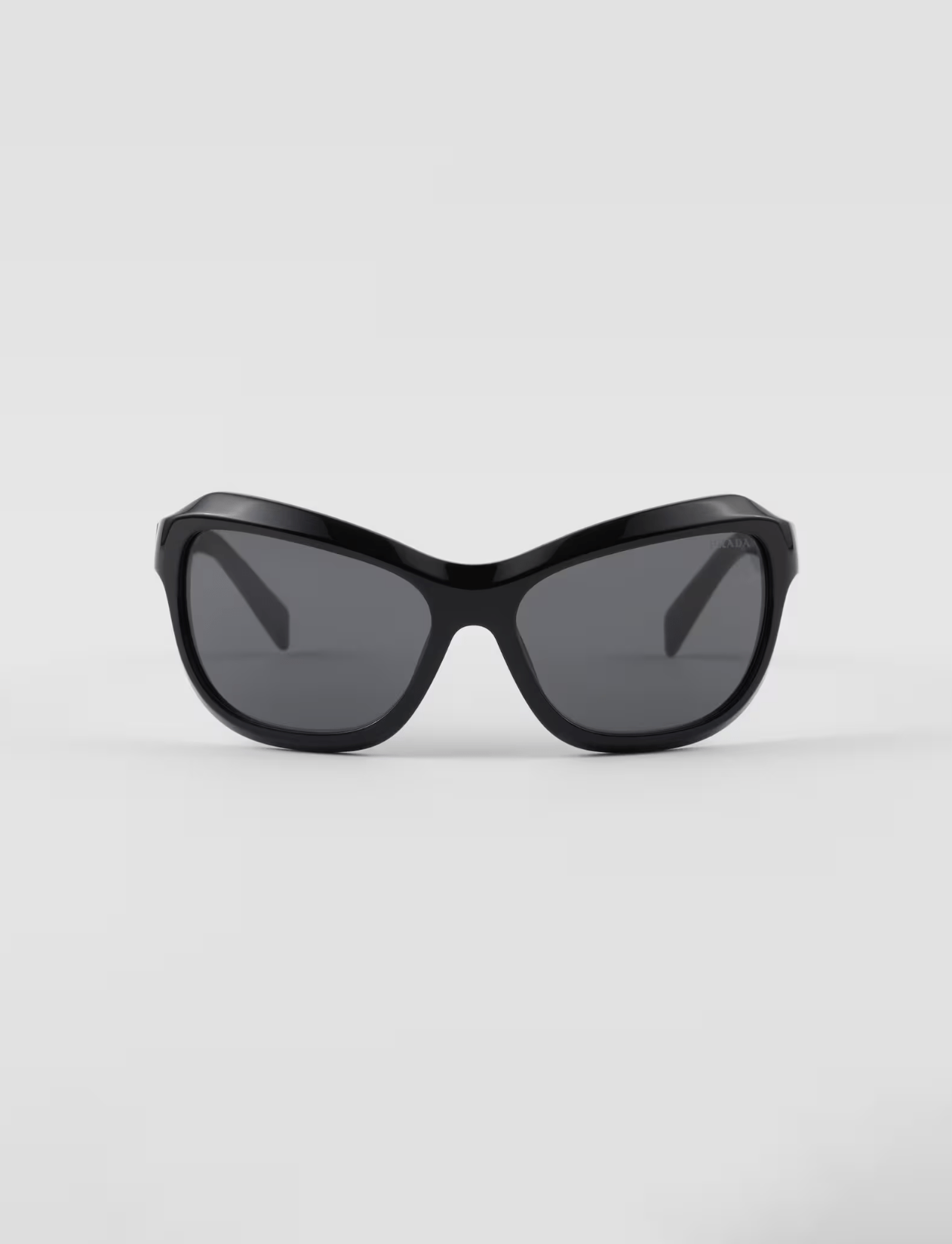 A pair of black sunglasses on a white background.