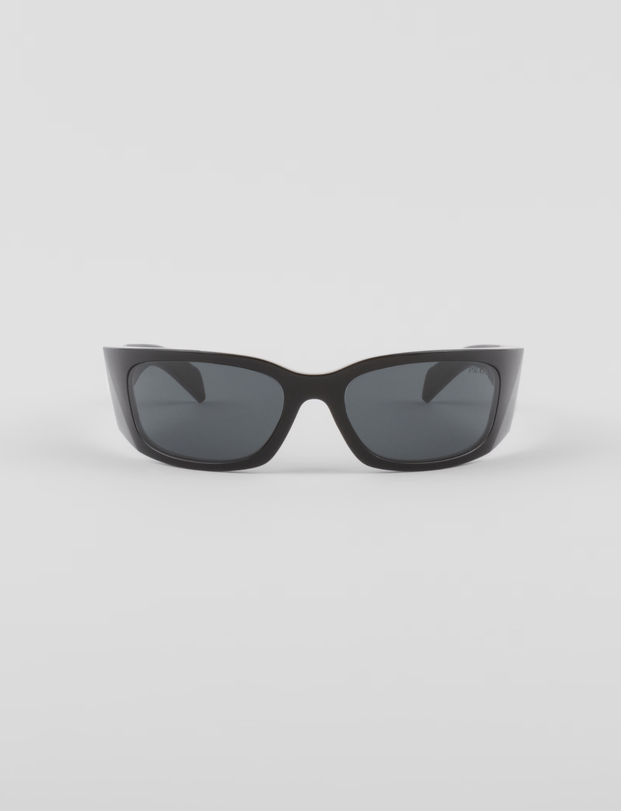 A pair of black sunglasses on a white background.