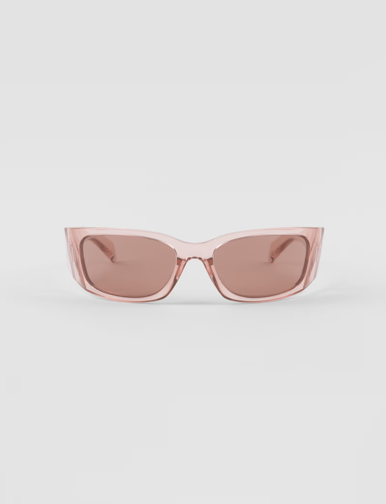 A pair of pink sunglasses on a white background.