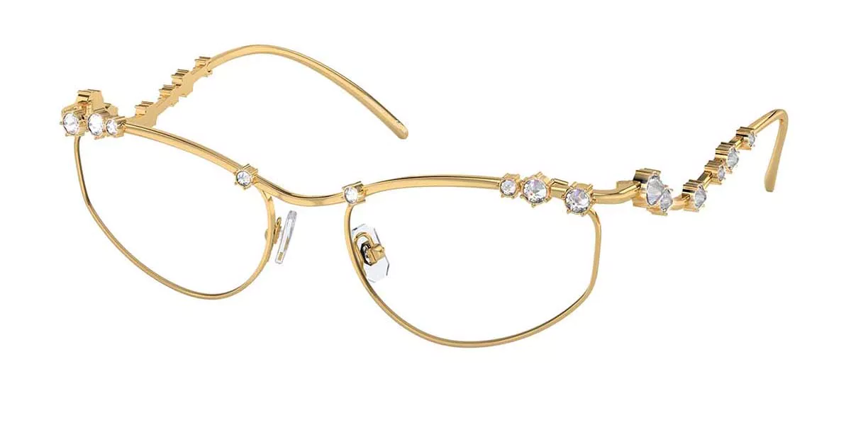 A pair of gold glasses with rhinestones on them on a white background.