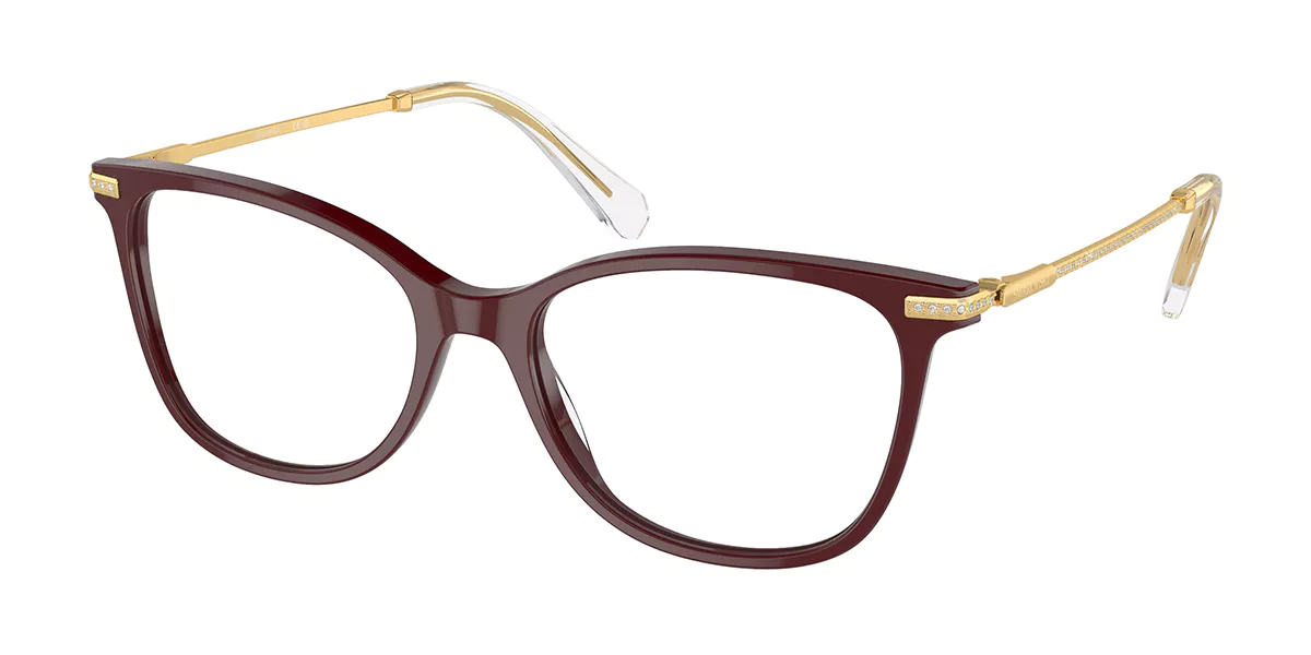 A pair of glasses with a burgundy frame and gold arms on a white background.