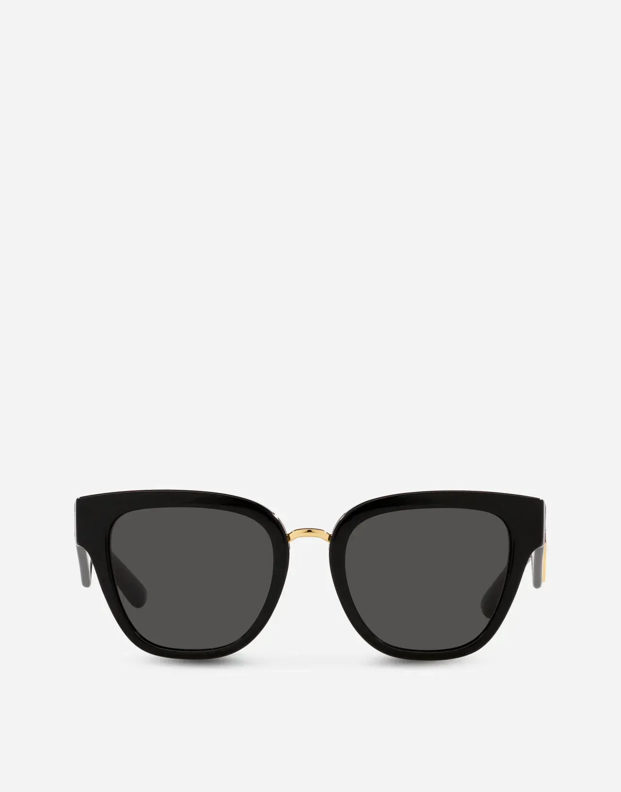 A pair of black sunglasses with a gold frame on a white background.