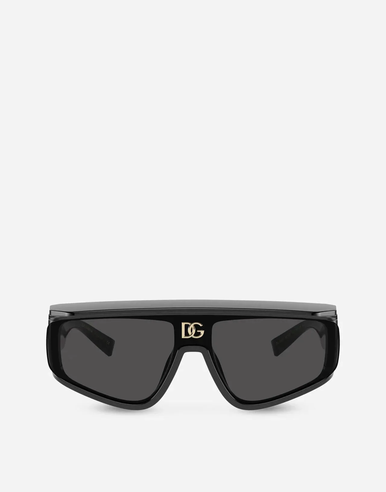 A pair of black sunglasses with a gold logo on the side on a white background.