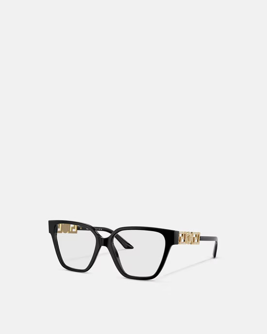 A pair of black glasses with gold trim on a white background.