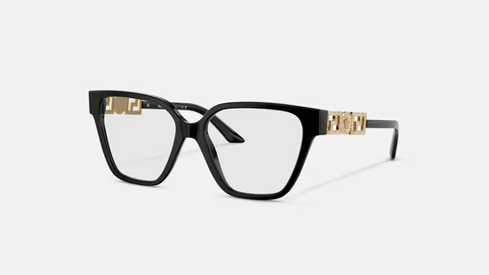 A pair of black glasses with gold trim on a white background.