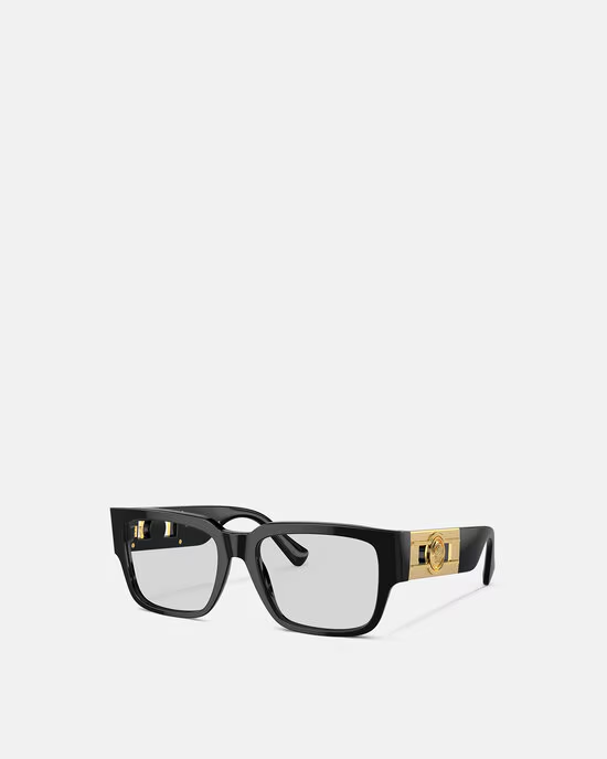 A pair of black and gold glasses on a white background.