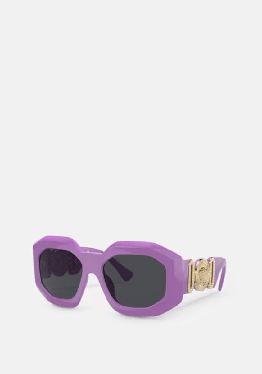 A pair of purple versace sunglasses on a white background.