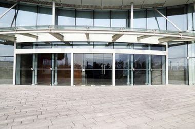 Facade of modern Business Center with glass doors - Window repairs in Modesto, CA