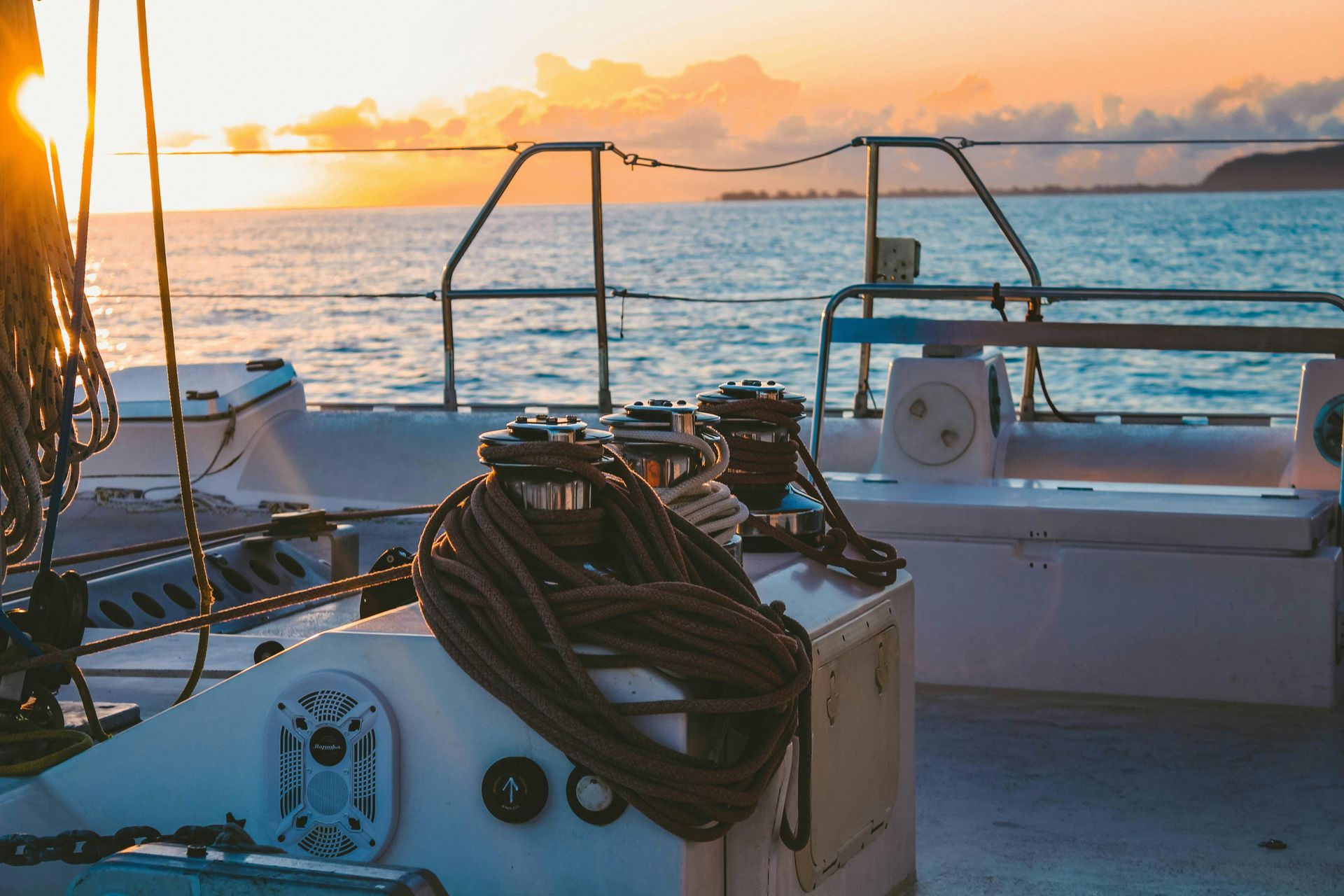 A boat is parked in front of a marina sign.