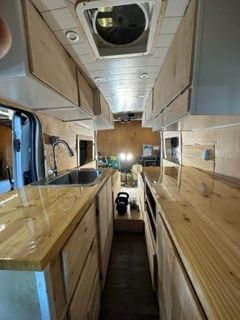 Man puts thermal insulation on the inside of a van