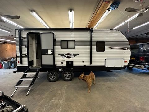 worker in helmet repair detail in car auto service
