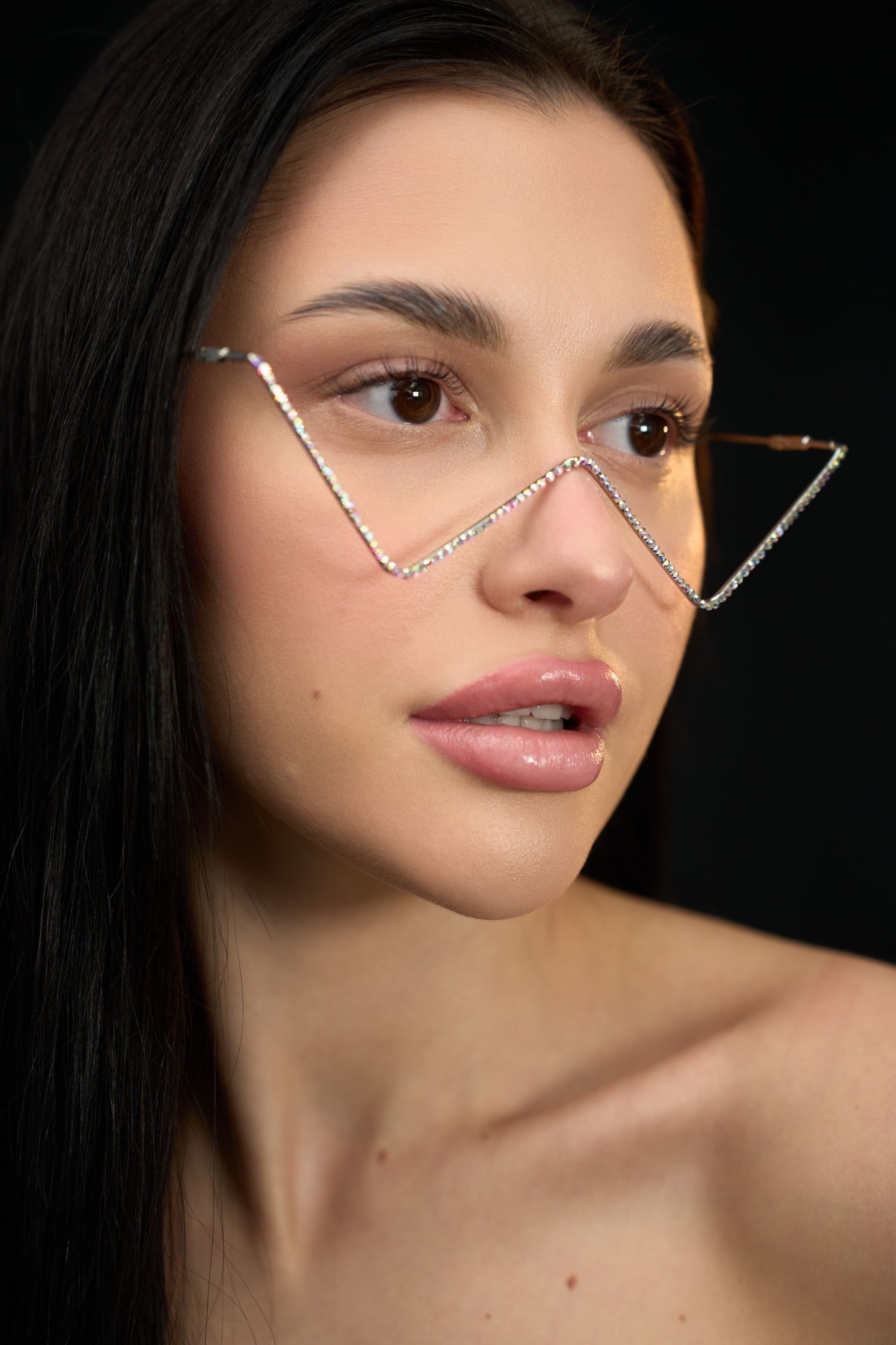 A close up of a woman wearing a pair of glasses.
