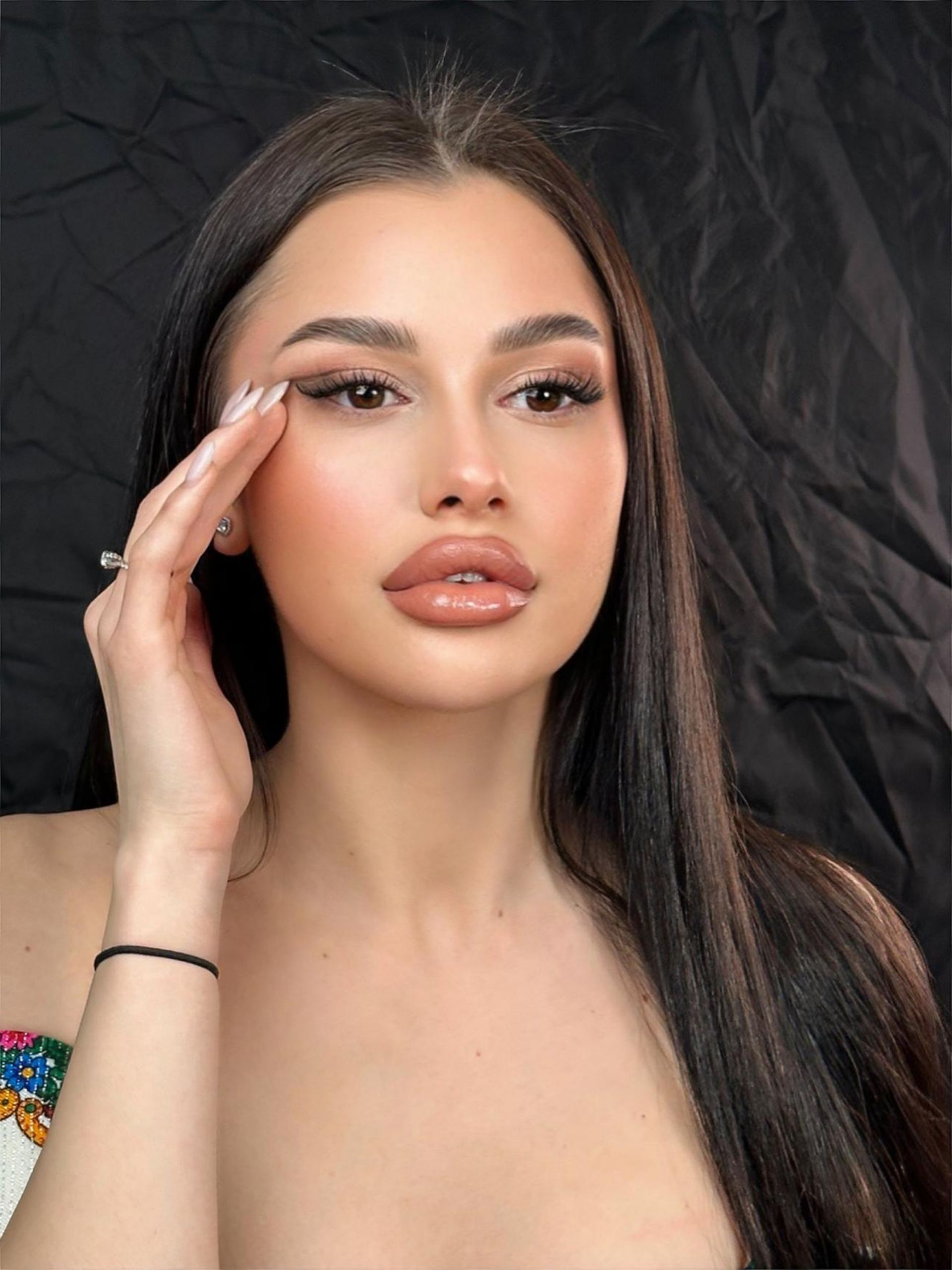 woman touching her eyelash