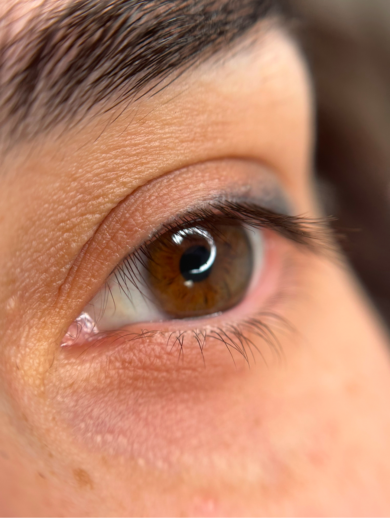 A close up of a person 's eye with makeup on.