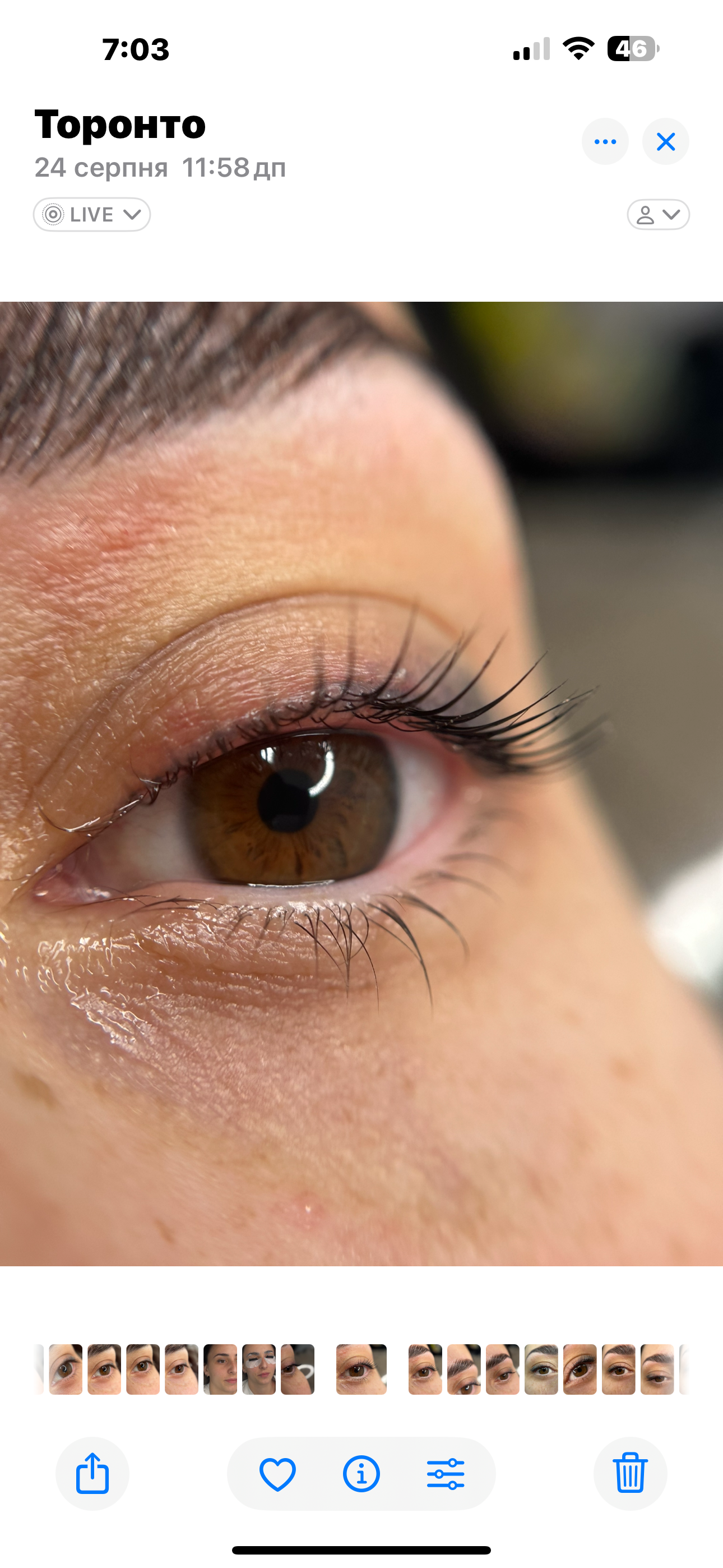 A close up of a woman 's eye with long eyelashes.