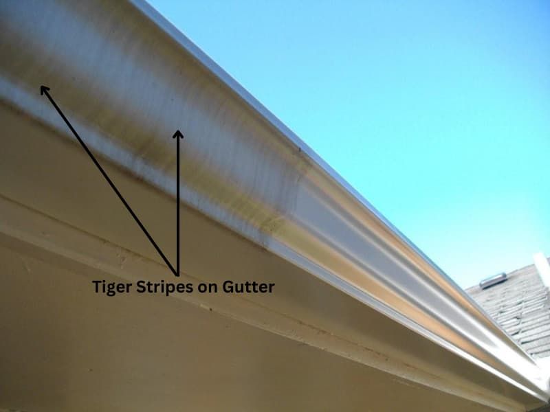 A picture of a gutter with tiger stripes on it
