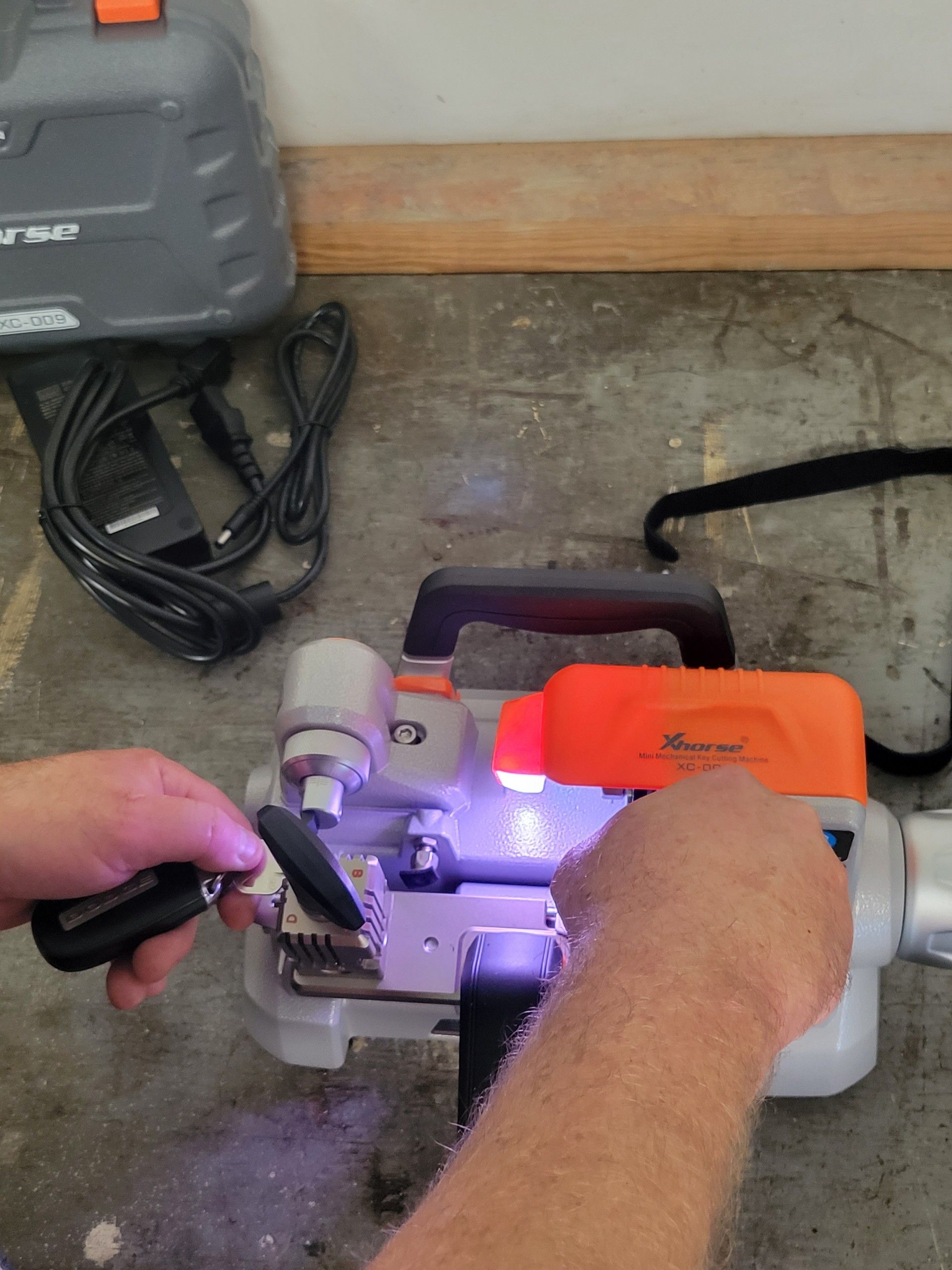 A person is working on a machine with a light on it