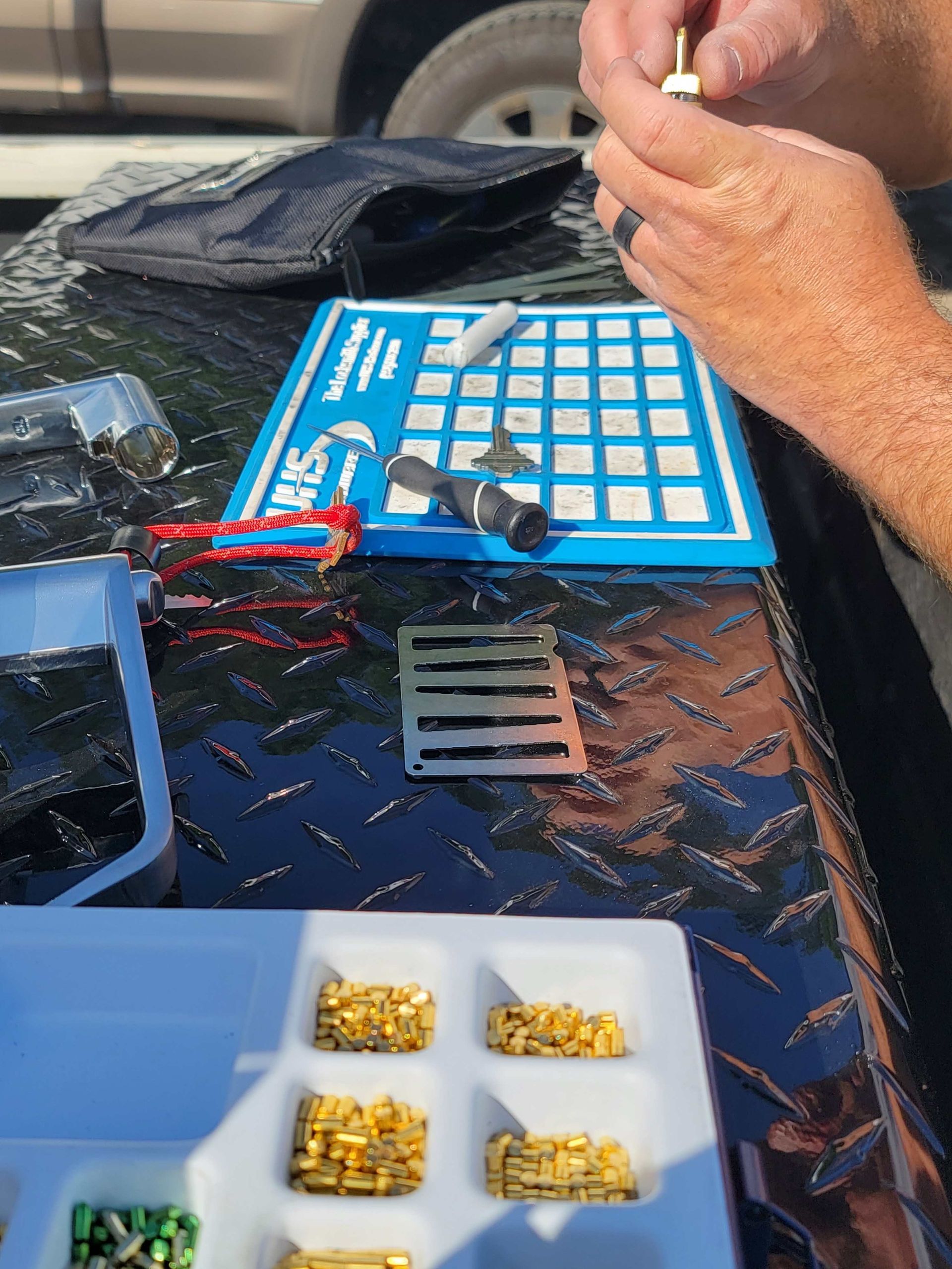 A person is sitting at a table holding a key.