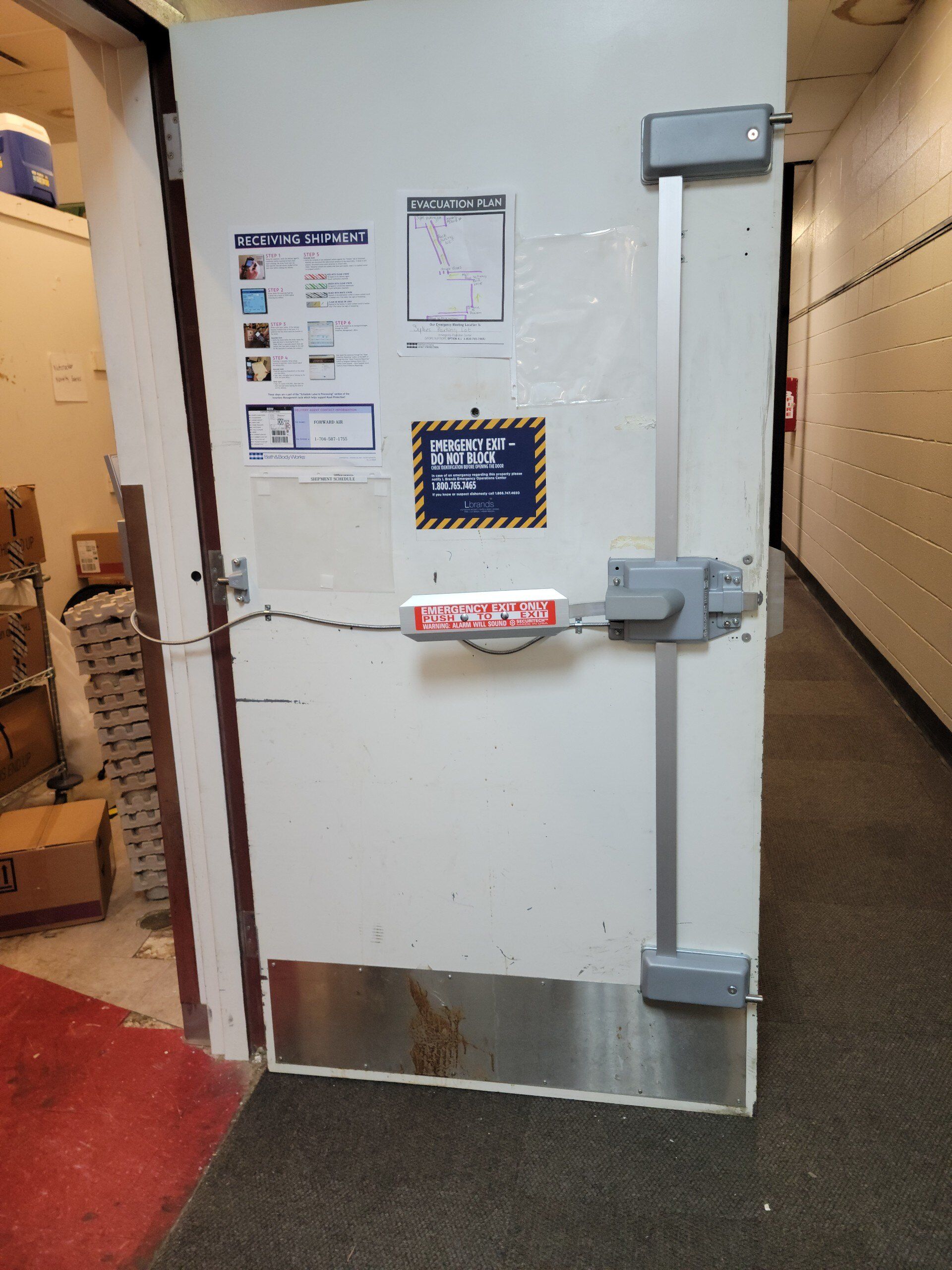 A white door with a sign on it that says sgs