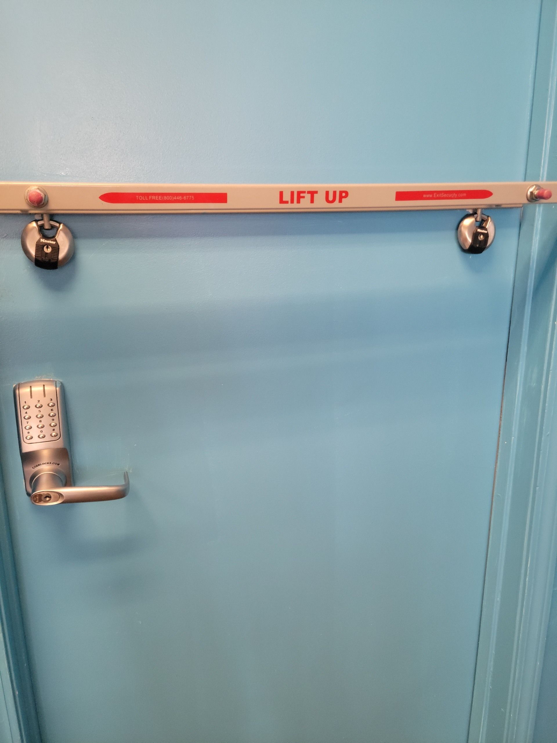 A blue door with a lift up sign on it.