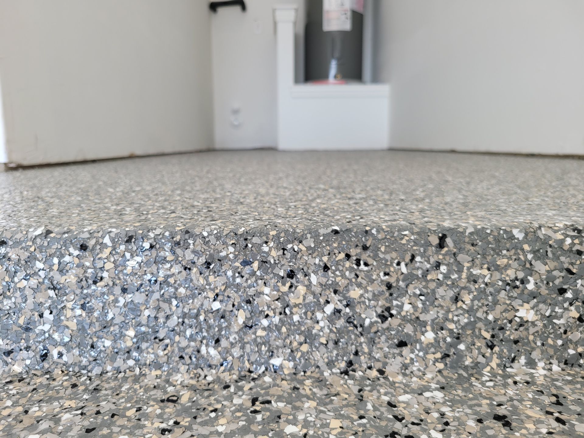 a close up of a concrete floor in a garage