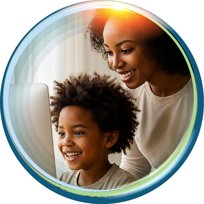 A smiling parent and child looking together at a computer screen.