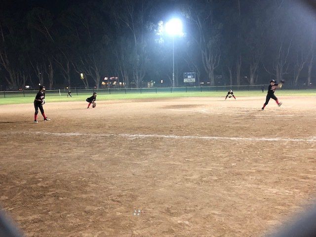 Softball Players Playing In Field — Salinas, CA — TechPro Athletics