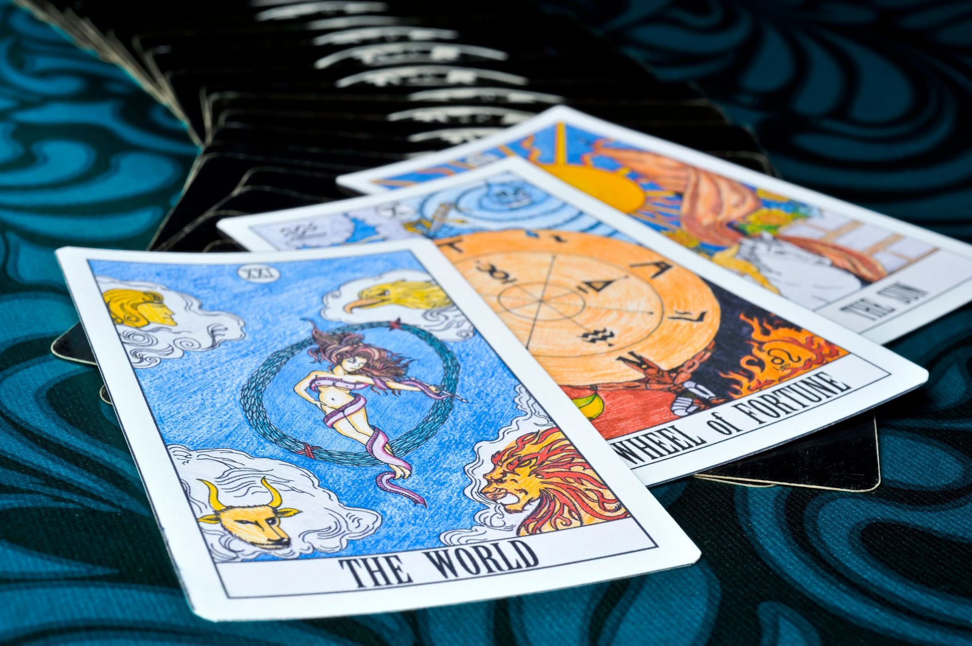 Three tarot cards on a table