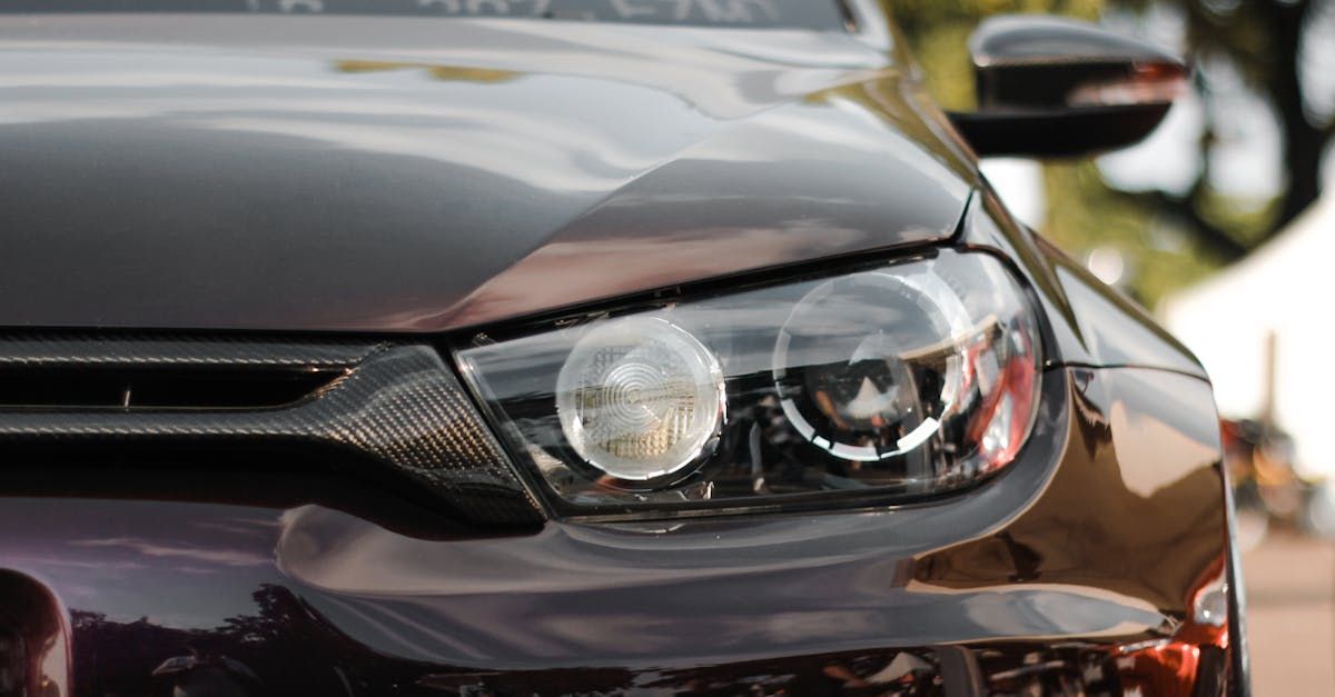 A close up of a black car 's headlight | Superior Auto Service