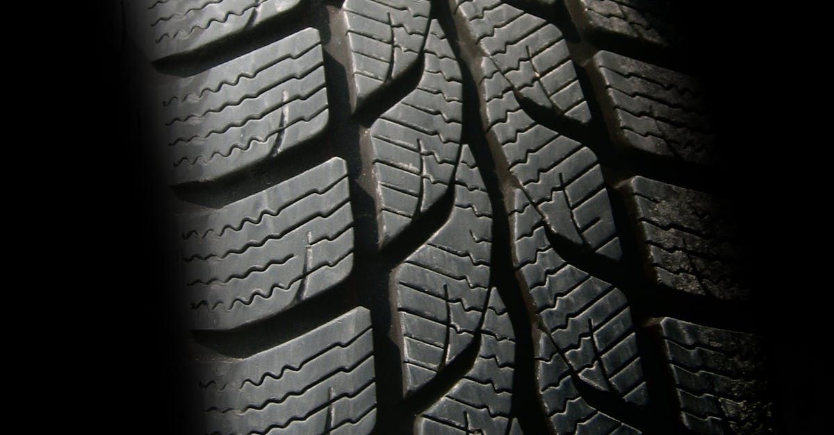 A close up of a tire on a black background | Superior Auto Service