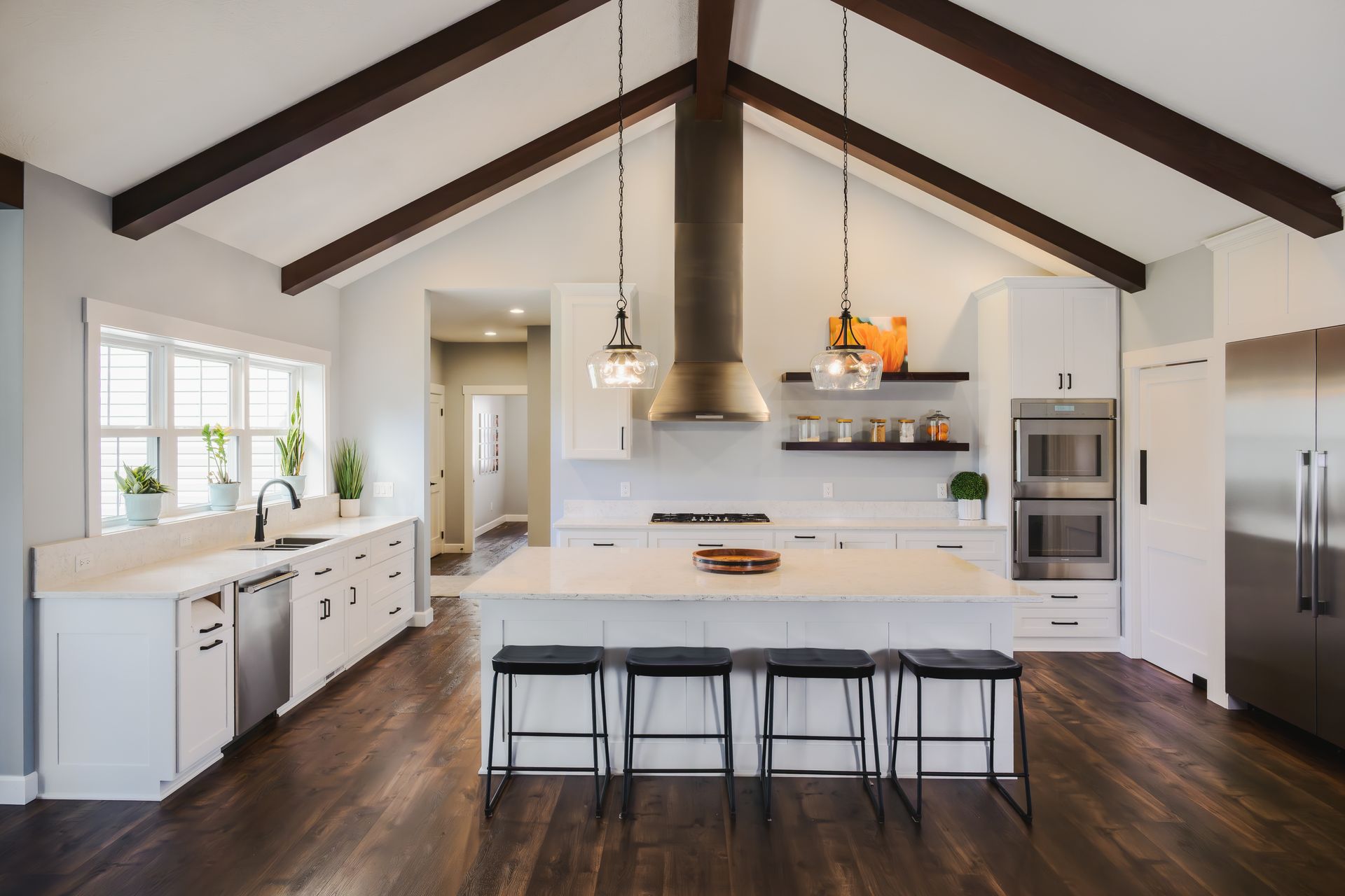 Custom kitchen cabinets & island. Painted white, modern look with quartz countertops.