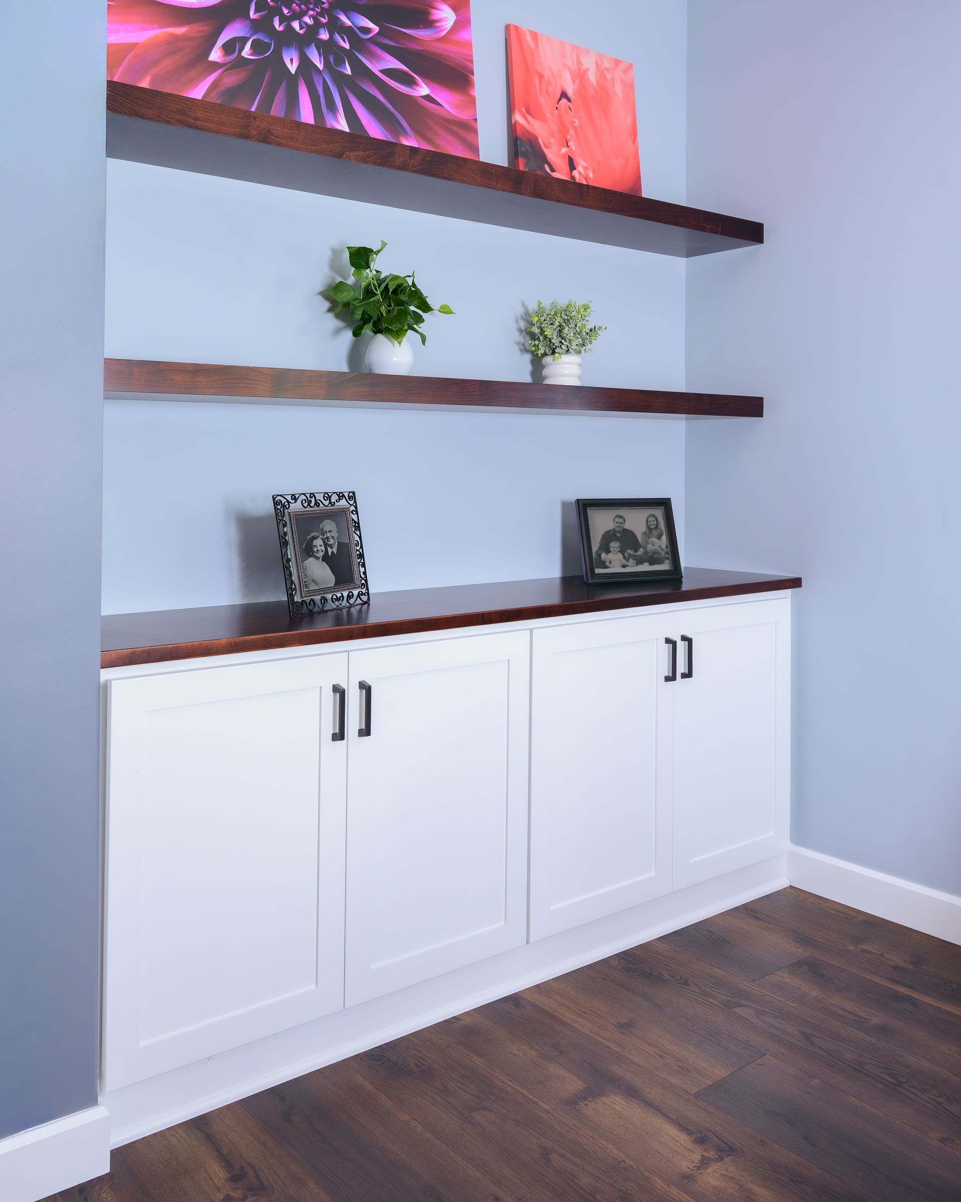 Custom stained wood floating shelves in living room.
