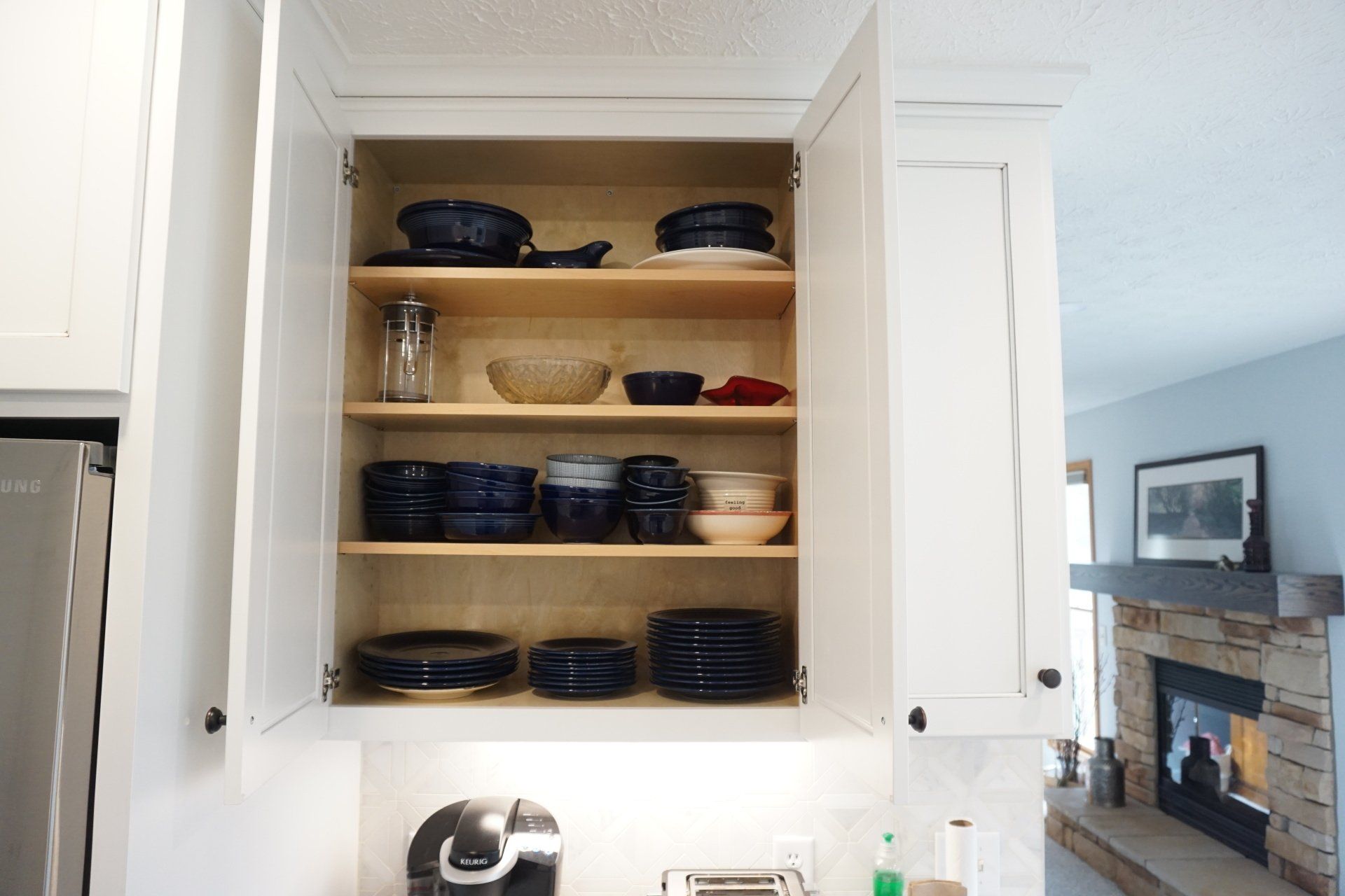 Custom wood adjustable shelves for upper kitchen cabinets.