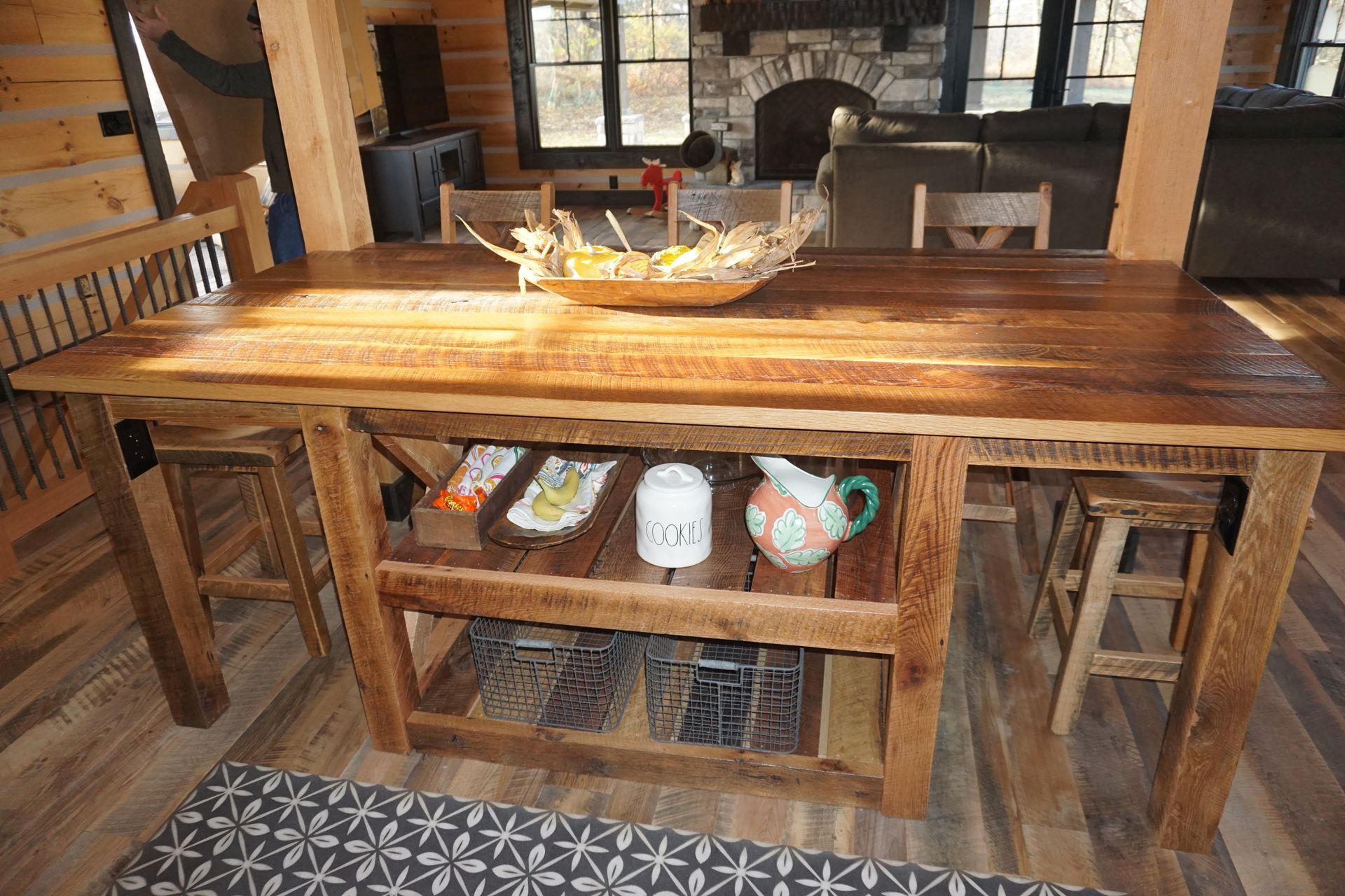 Custom rough sawn rustic wood table with storage below.