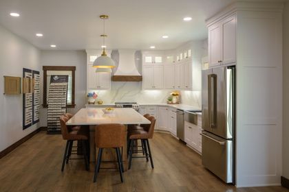 Interior view of Eicher Woodworking showroom featuring custom kitchen cabinets and quartz countertops.