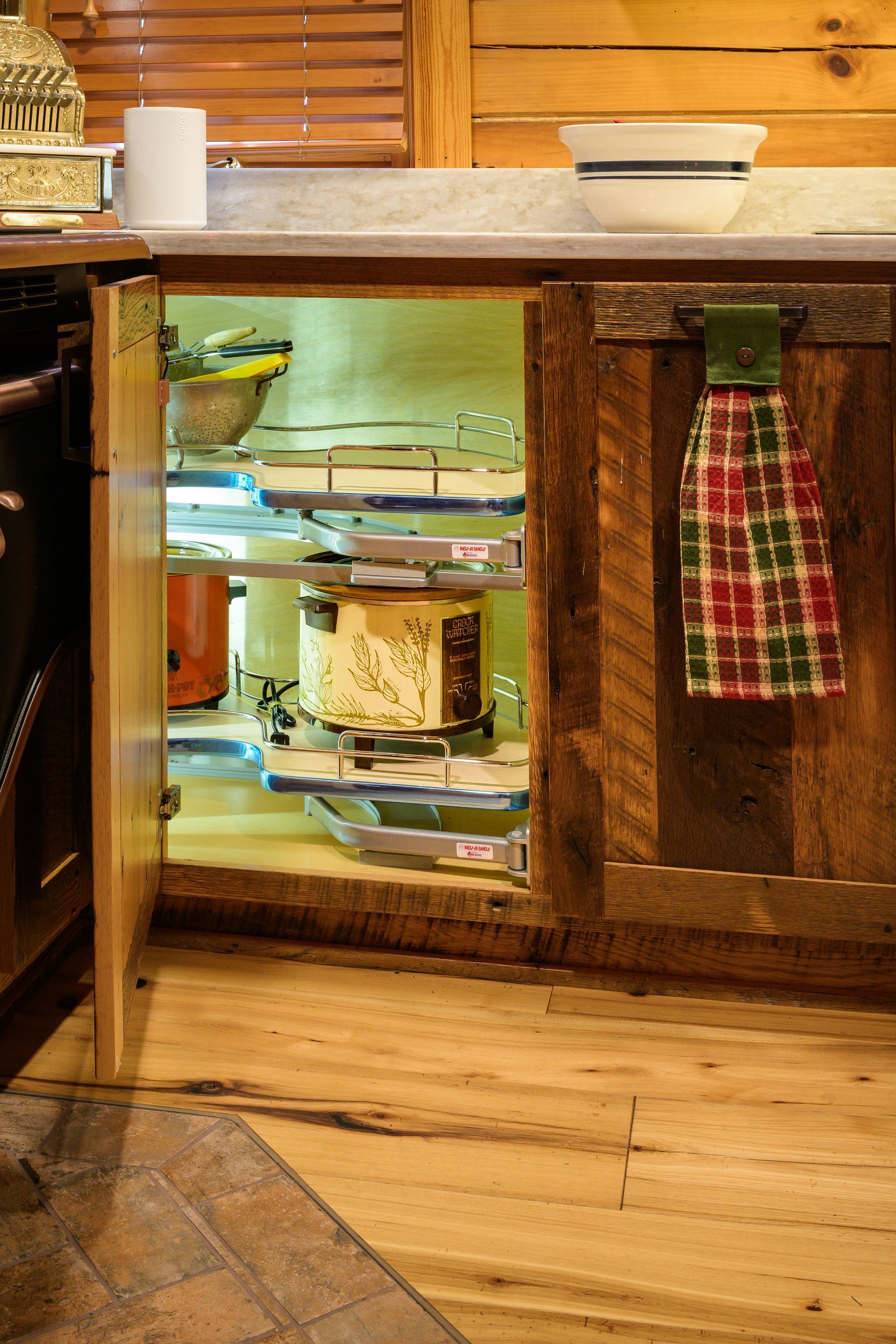 Custom reclaimed barnwood kitchen cabinets with Rev-a-Shelf double blind corner organizer with door open.