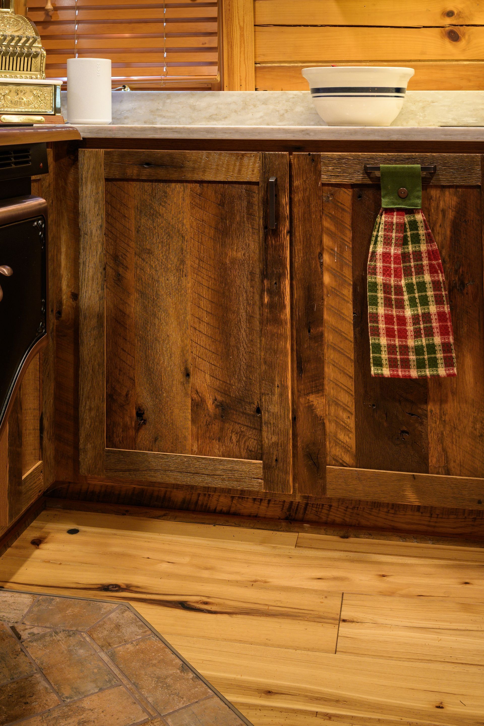 Custom reclaimed barnwood kitchen cabinets with Rev-a-Shelf double blind corner organizer with door closed.