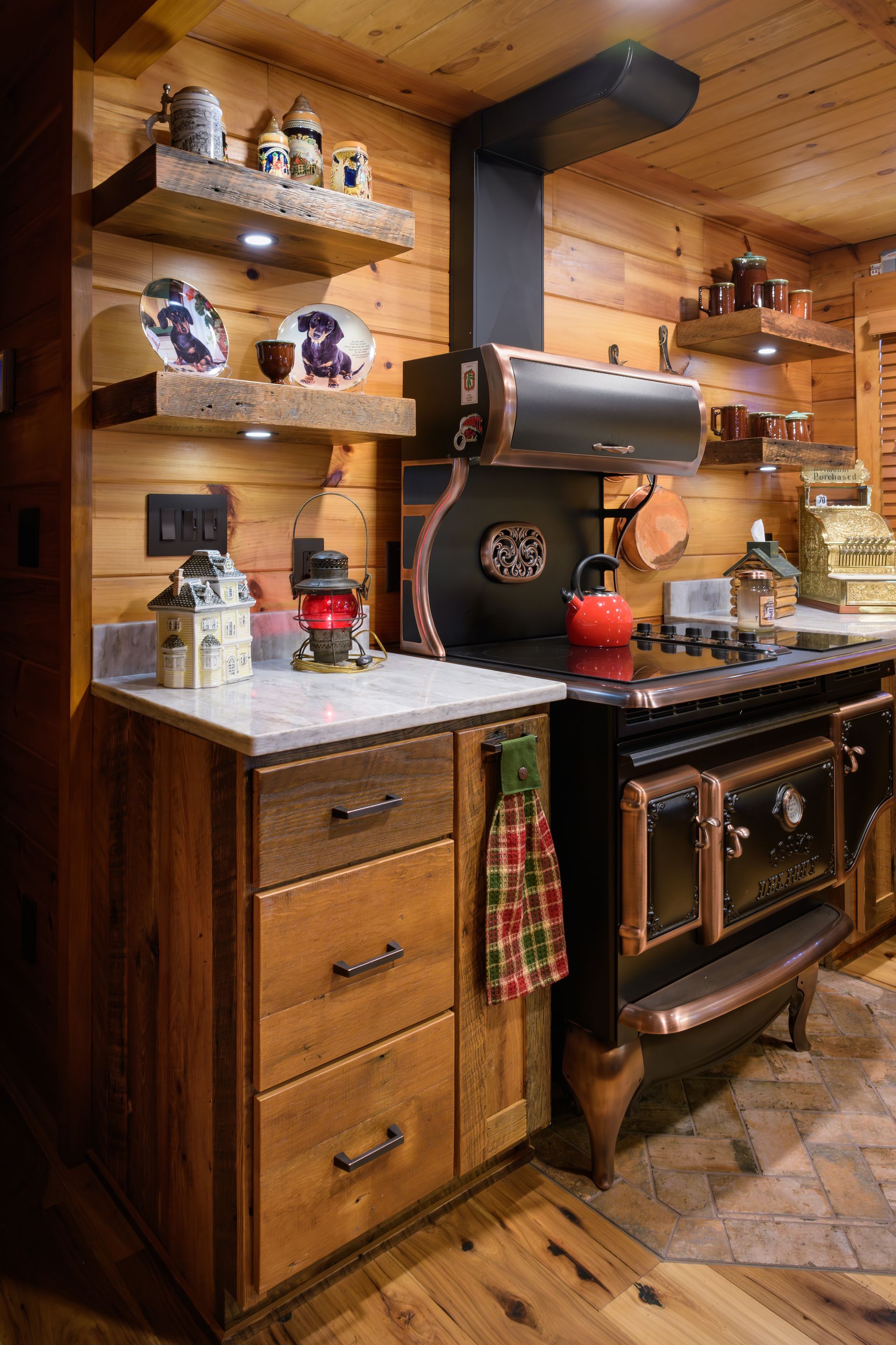 Custom reclaimed barnwood floating shelves in kitchen.