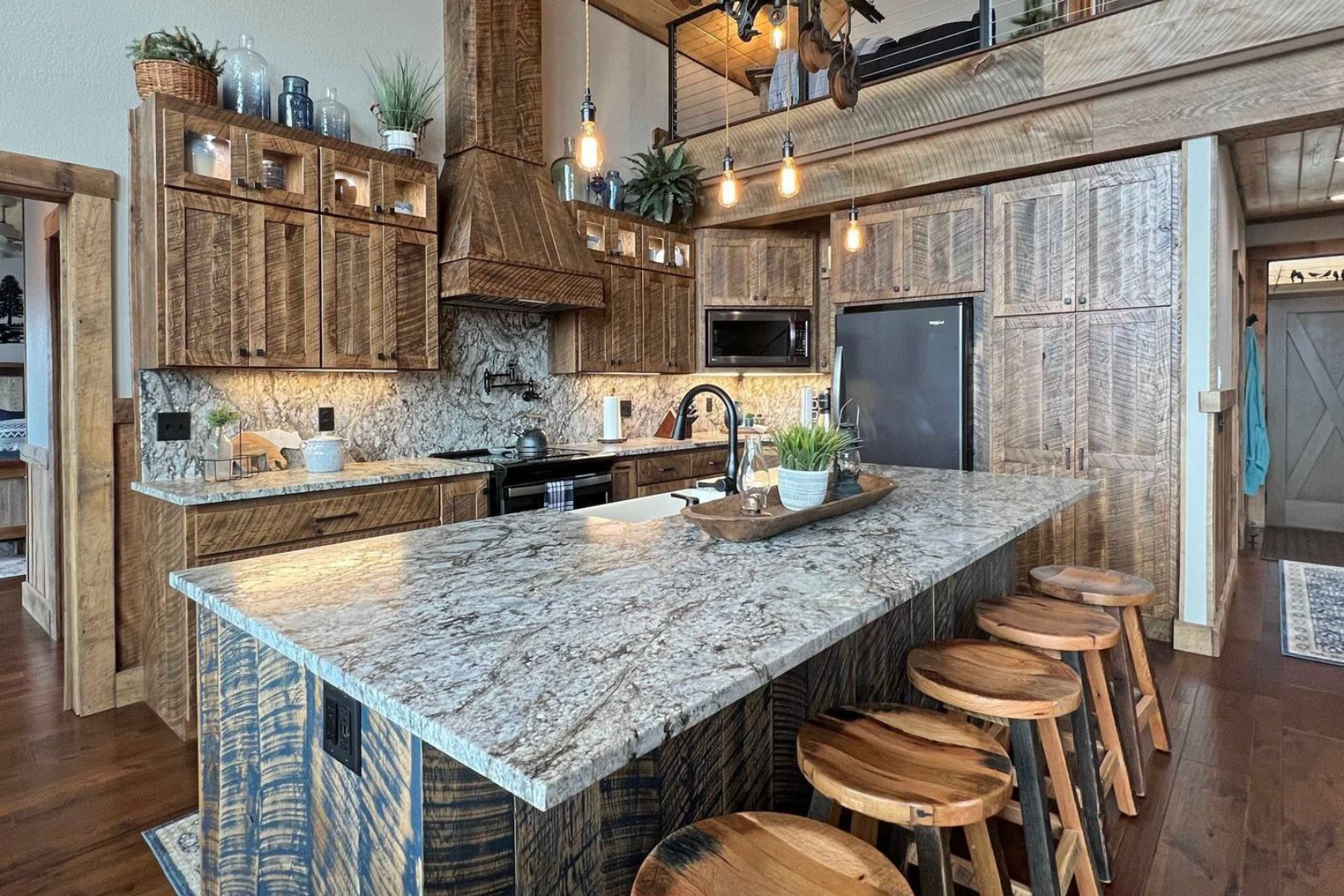 White painted double bathroom vanity with arched top mirrors.
