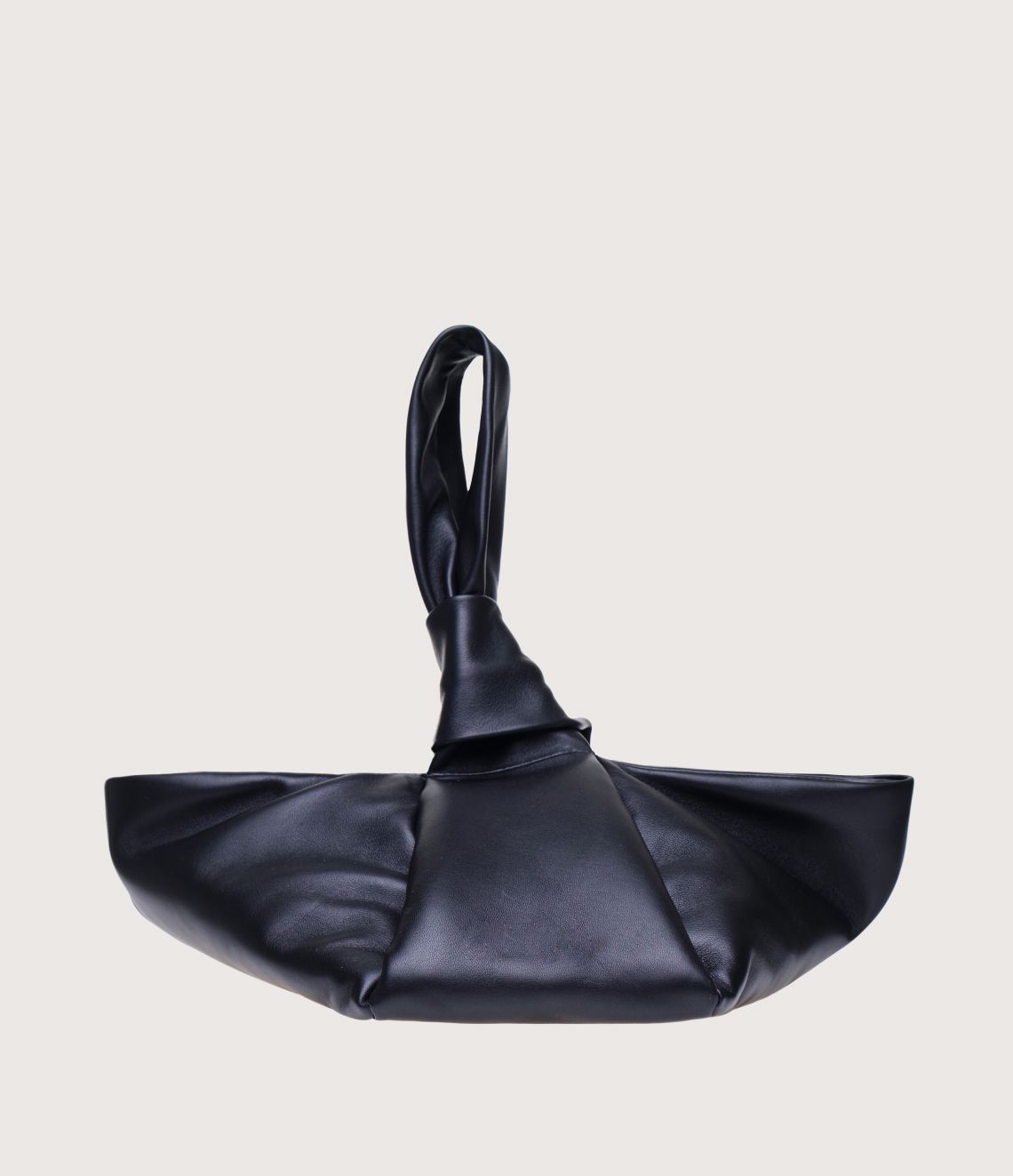 Black leather handbag with knot detail on handle.