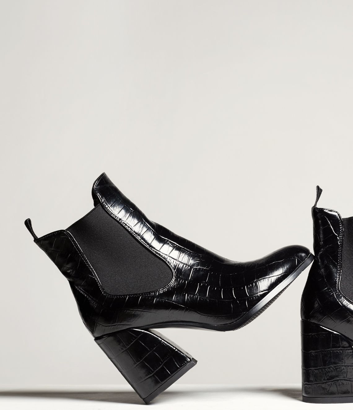 Black ankle boot with block heel and elastic side panels.