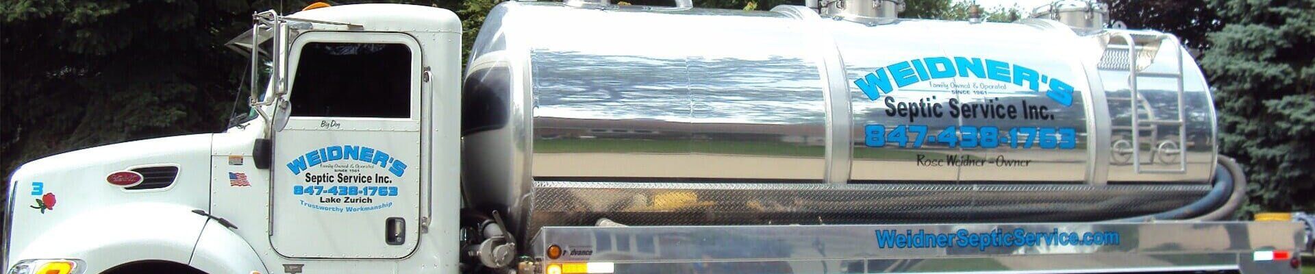 White truck with a silver tank.