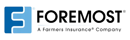 A blue cross of idaho logo with a mountain in the background