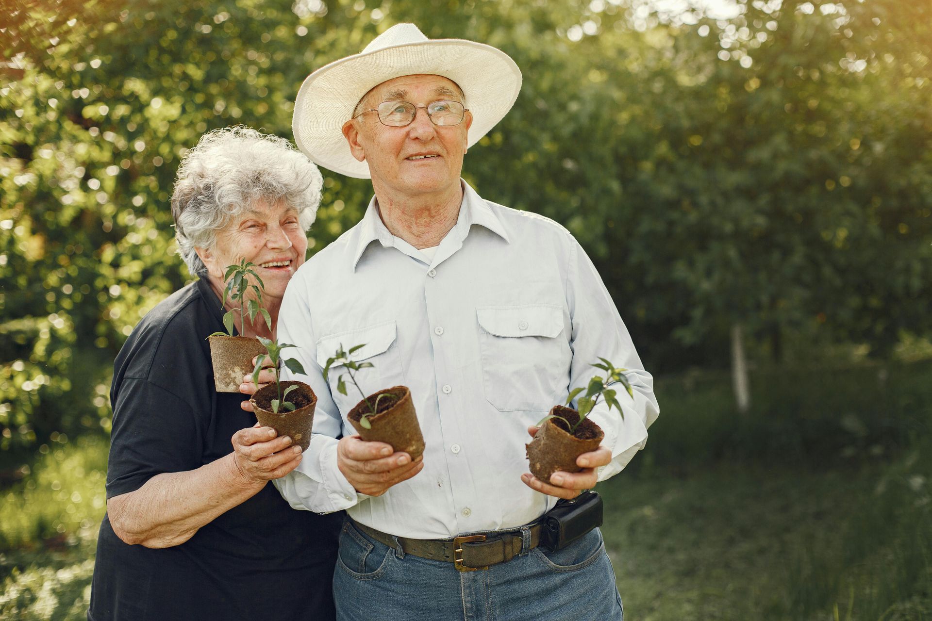 A woman is walking down the street holding a cup of coffee.