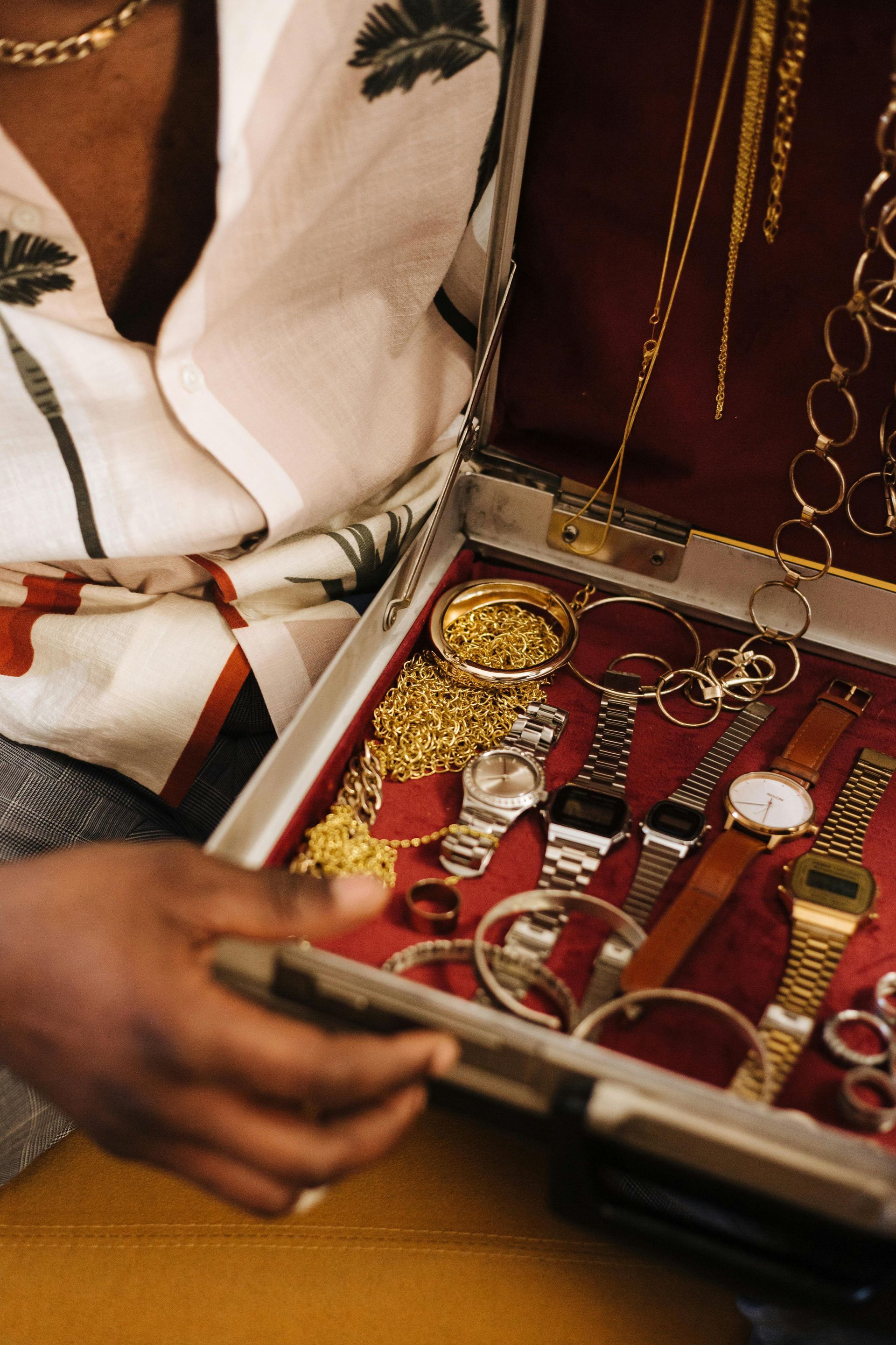 A woman is sitting at a table looking at her cell phone.