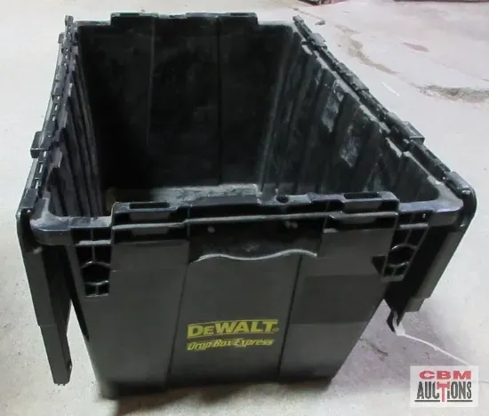 Black DeWalt storage bin on a concrete floor, empty, with the brand logo visible.